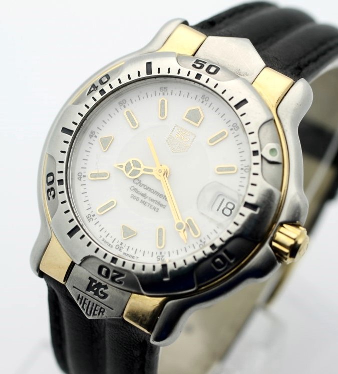 TAG HEUER "6000" Automatic Chronometer 18 Karat &: Men's 18 Karat Gold & Stainless Steel 37.5mm TAG HEUER With Aftermarket Leather Strap. Reference WH5151-K1. 200 Meter Water Resistance. Watch Is Currently In Working Order. No Buyers Premium.