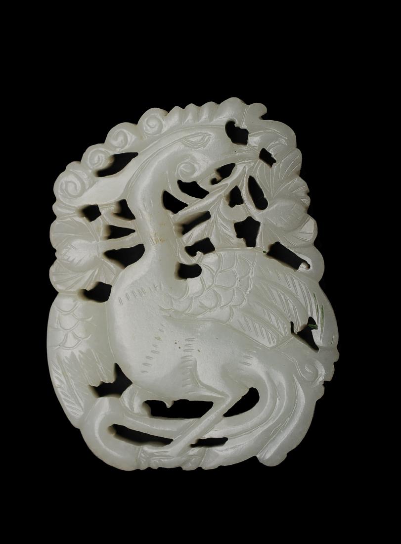 Carved Jade Plaque with Phoenix, 18th - 19th Century: Carved white jade plaque of a phoenix from the 18th - 19th century. This white jade plaque is carved in openwork with a phoenix amongst flowers. Dimensions are 2 inches wide by 2 1/2 inches high. All