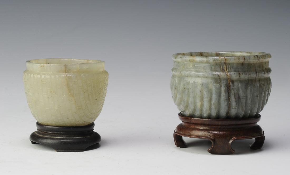 Two Jade Brush Washers, Ming Dynasty: Pair of jade brush washers from the Ming dynasty. Includes: Grey jade brush washer carved into a basket shape and a white and grey jade brush washer that has been carved to look like a basket. Both ha