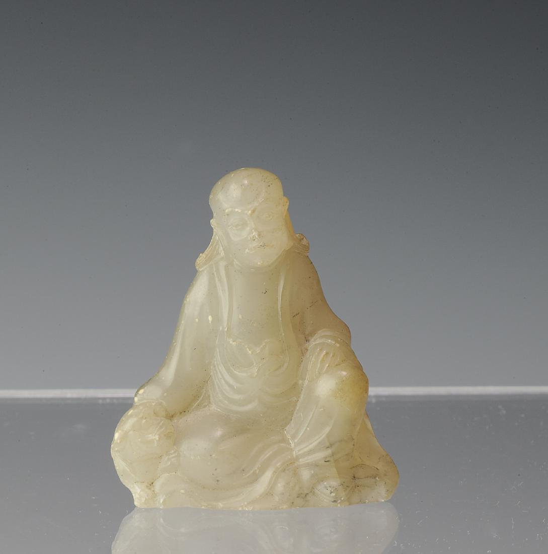 Carved Soapstone Tiger & Lohan, 18th - 19th Century: Small soapstone carving of a tiger and Lohan from the 18th - 19th century. Carved into the form of a Lohan, seated with one hand on his knee while petting a tiger with the other hand. Dimensions are 1