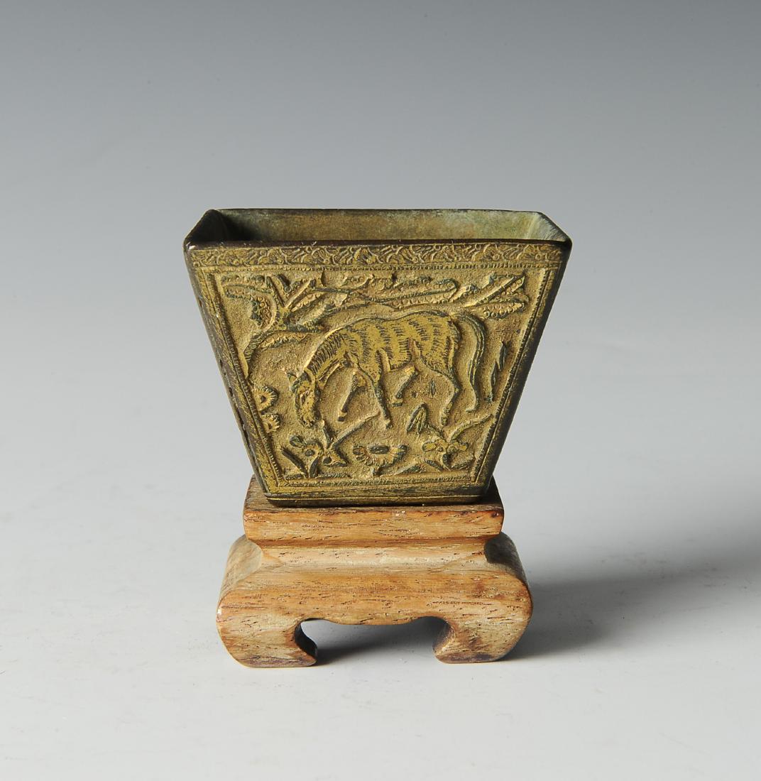 Bronze Incense Burner w/ Horses, Ming Dynasty: Small, gilt bronze incense burner from the Ming dynasty. The incense burner is in the form of a small, square cup. The sides of the burner have been molded into different scenes, each featuring a hors