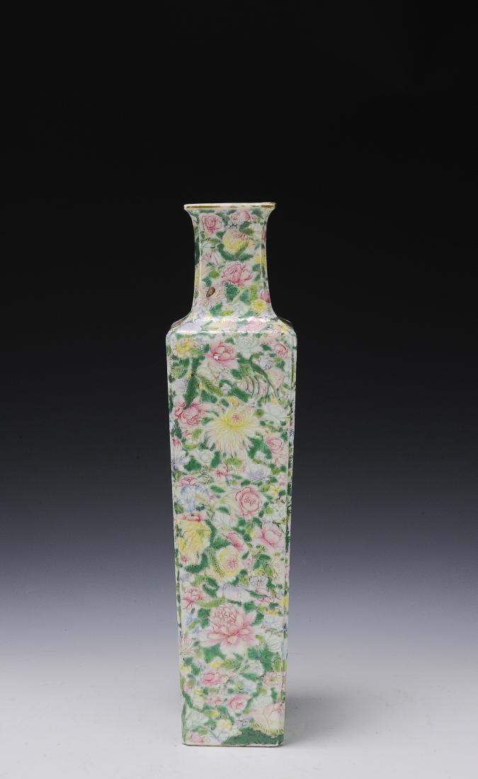 Square Famille Rose Vase, Republic Period: Square famille rose vase with millefleur motif from the Republic period. This tall, square vase is covered in pink, yellow, and green flowers about the body. It has a red six character seal. Dimension
