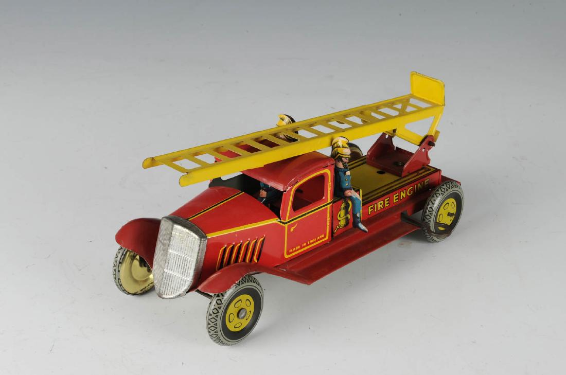 Wells Windup Fire Ladder Truck: Made in England. Complete and working. Dimensions are: 9 1/4" long. All measurements are approximate.