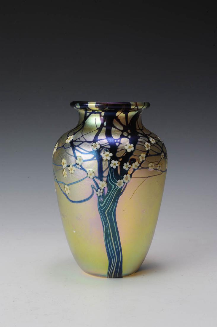 Orient & Flume Iridescent Hawthorne Vase: Retains paper label, dated 1979, marked A55. Dimensions are: 7" tall. All measurements are approximate.