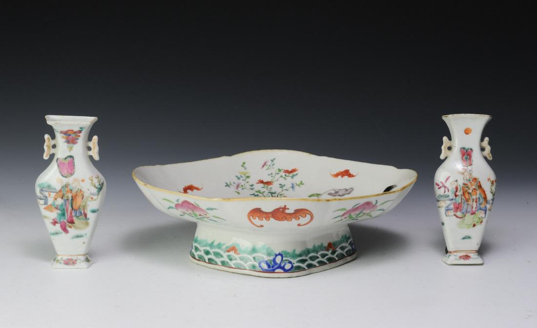 Famille Rose Platter & Pair of Wall Vases, 19th C: Famille rose footed platter and a pair of wall vases dating from the late 19th century. The platter is decorated with the 8 Buddhist symbols and gardens being grown in planters. The wall vases depict 