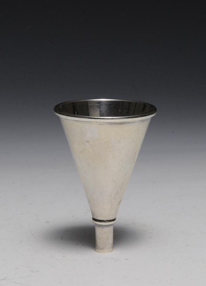 A Sterling Silver Wine Funnel: Hallmark from R. Blackinton & Co. North Attleboro, MA. circa 1900. Total weight 30 grams. Dimensions are: 3" long, 2" diameter. All measurements are approximate. Condition: Some small dings. Very Good