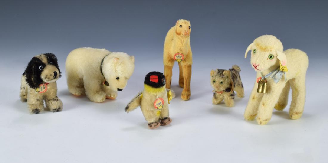 Group of 6 Steiff Animals w/ Tags: Group includes: Peggy, Cockie, Lamby, Polar Bear, Tabby, and a camel. Dimensions are the largest measures 3 1/2" tall X 6" wide. All measurements are approximate. Age wear, Very Good - Fine.