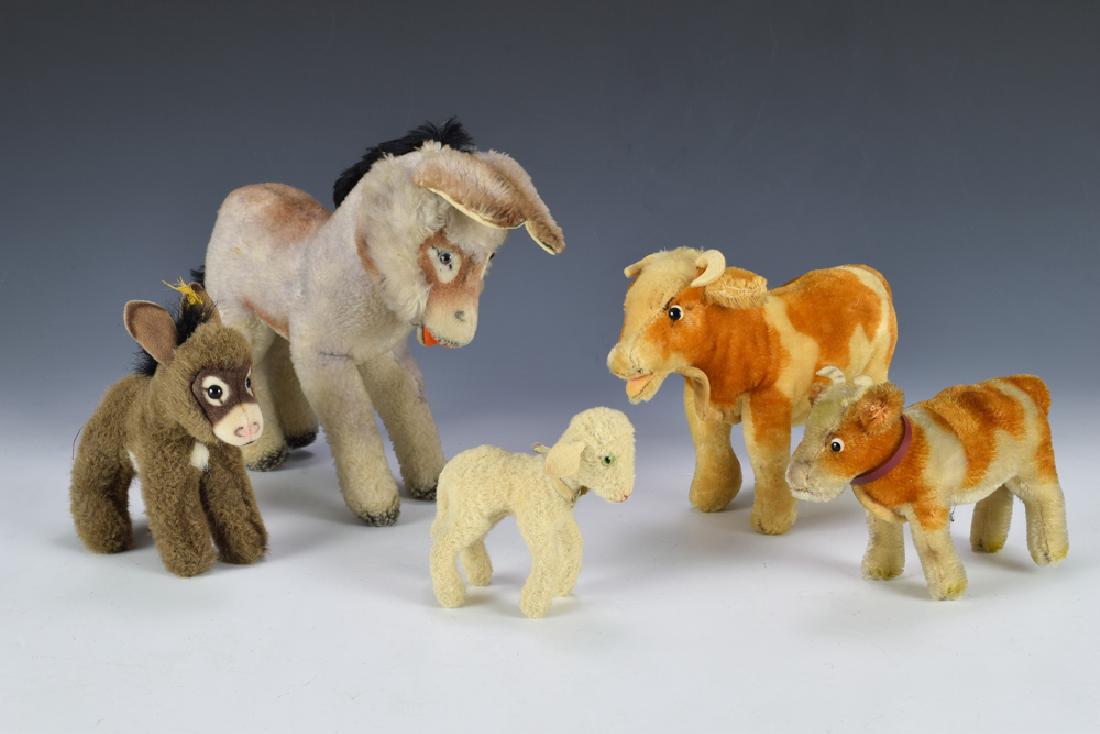 Group of 5 Steiff Farm Animals: Group of 5 Steiff farm animals including: 2 donkeys, 2 cows, and a lamb. Dimensions for the largest are: 8 1/2" tall X 10 1/2" wide. All measurements are approximate. Light wear, overall Very Good -
