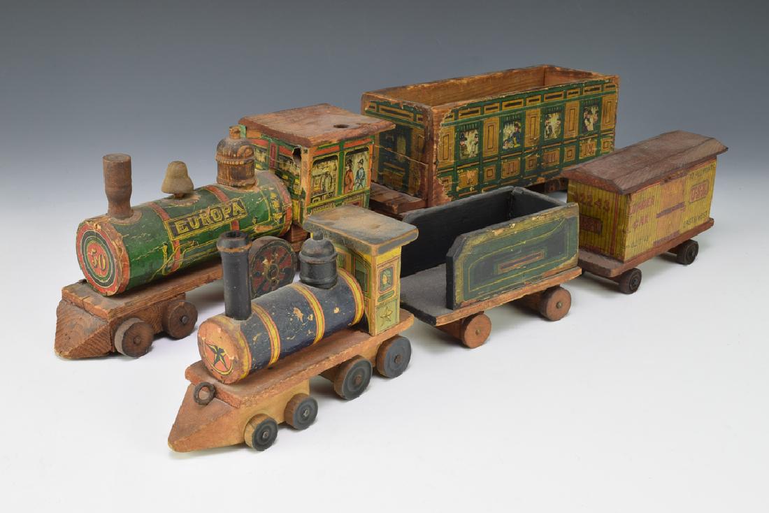 2 Paper Lithographed Toy Trains: This lot includes: 2 engines and 3 train cars. Dimensions of the largest train car are: 20 1/2" long. All measurements are approximate. Paper wear and losses, the largest train car has a wheel that ha