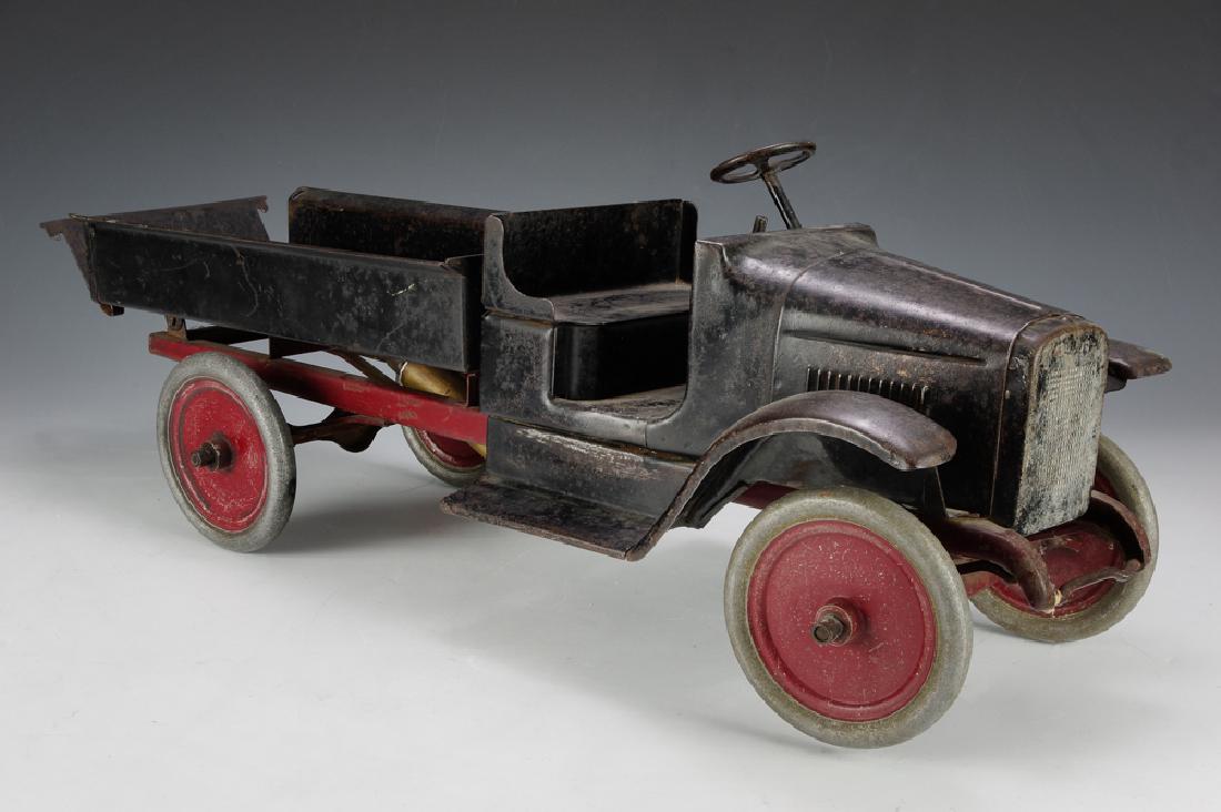 Buddy L Hydraulic Dump Truck: Original decal has some chipping. Dimensions are: 24" long. All measurements are approximate. Shows play wear and aging. Hydraulic ram needs fluid. Good.