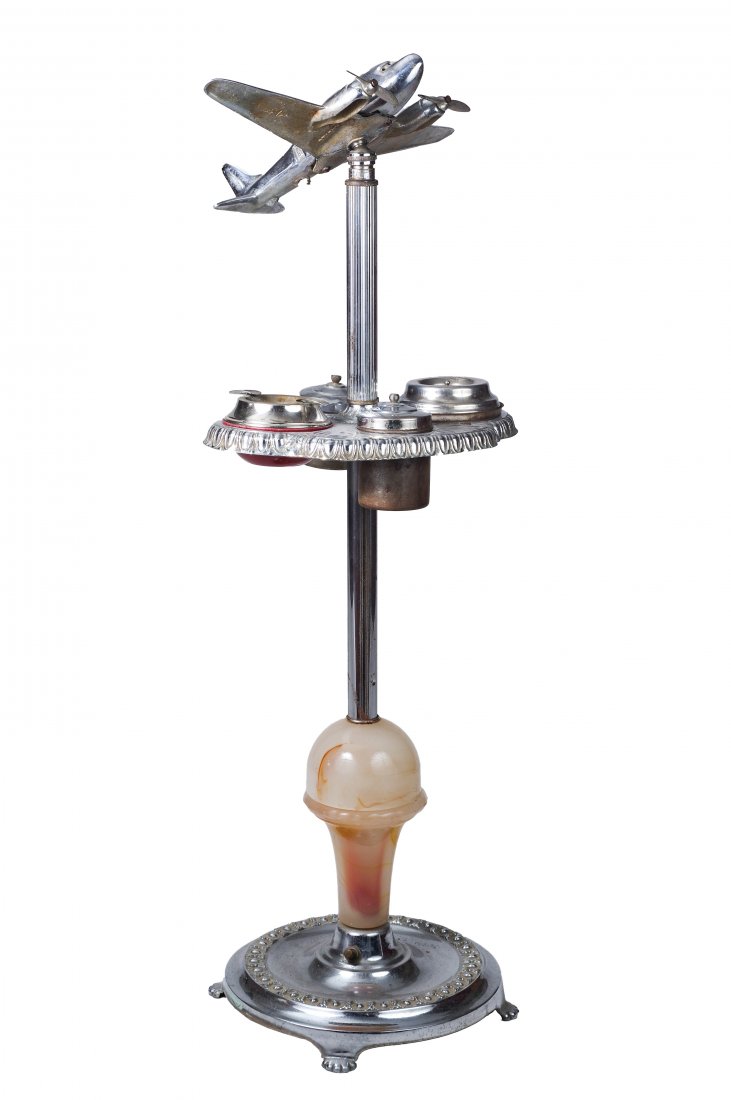Art Deco Metal Airplane Smoking Stand Lamp: Airplane is a DC-3. Alabaster base, complete with inserts. Dimensions are: 36 3/4" tall, base has 10 3/4" diameter. All measurements are approximate. Condition: Surface wear to plated parts. Very Good