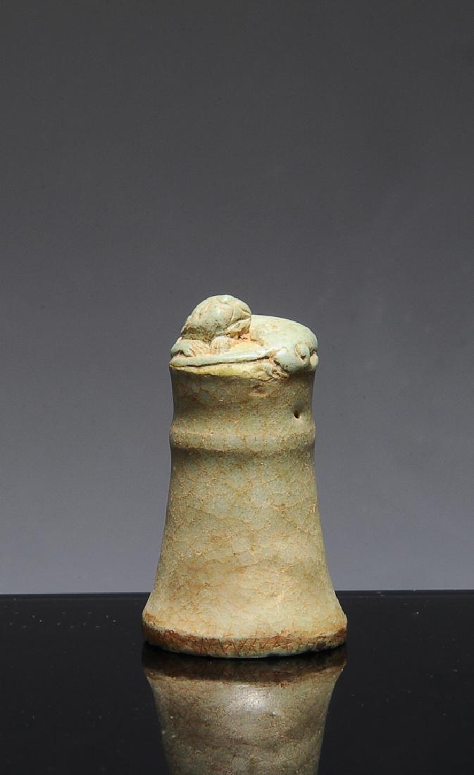 Chinese Celadon Porcelain Seal, Ming or Earlier: A celadon glaze porcelain seal with a guardian lion finial from the Ming dynasty or earlier. Dimensions are: 2 1/4 inches tall X 1 1/4 inches wide. All measurements are approximate Condition: The surf