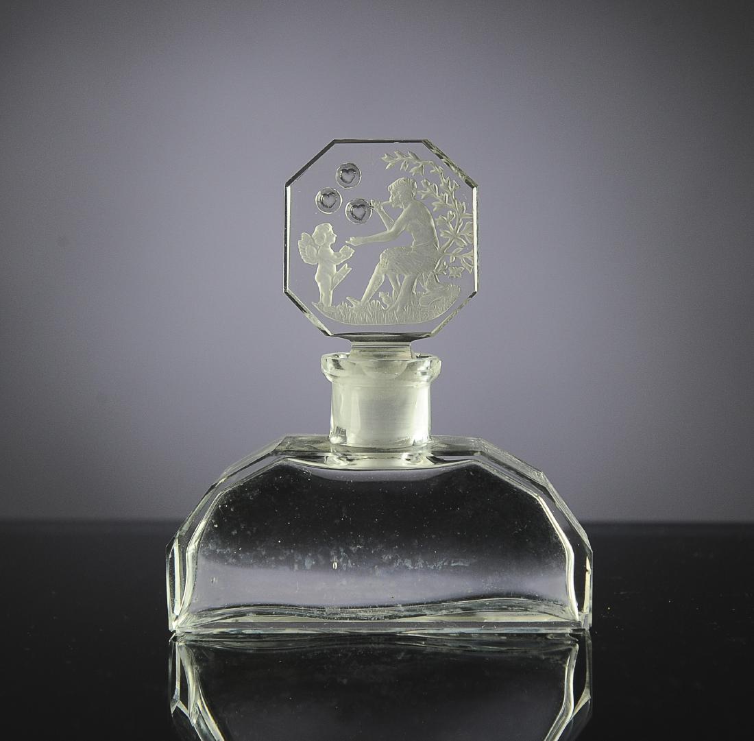 Crystal Clear Perfume w/ Bubble Blower Stopper: Unsigned, possibly Hoffmann. Intaglio stopper with Cupid and bubble blower. Dimensions are: 3 15/16" tall, 3 3/8" wide. All measurements are approximate. Condition: No noted damage. Excellent. Provena