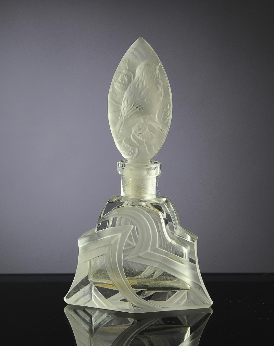Czech Glass Perfume Bottle from Aristo: Frosted abstract design with frosted stopper depicting a sparrow. Has original label to bottom. Dimensions are: 5 1/4" tall. All measurements are approximate. Condition: Small flecks from ground area 