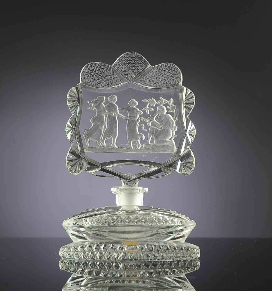 Czech Perfume Bottle, Intaglio Dancers, Morlee: Paper label on bottom and signed 'Made in Czechoslovakia'. Large intaglio stopper with pan flautist and three dancers. Dimensions are: 5 7/8" tall, stopper 3 3/8" wide. All measurements are approximat