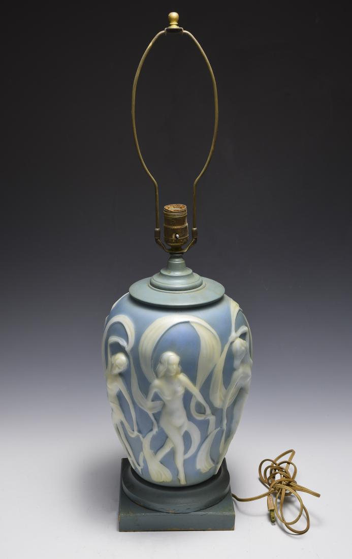 Cameo Glass Lamp with Nudes: Blue and cream glass lamp on wood base is probably by Phoenix or Consolidated Glass. Dimensions are: 29" tall, 9" dia. All measurements are approximate. Condition: Some paint loss to wood base, light 