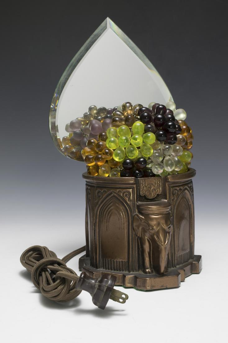 Czech Glass Fruit Basket Lamp: On a spelter base with elephant and mirrored back. Dimensions are: largest 11 1/4" tall, 6 3/8" wide. All measurements are approximate. Condition: A couple of age cracks to base. Very Good - Fine. Pro