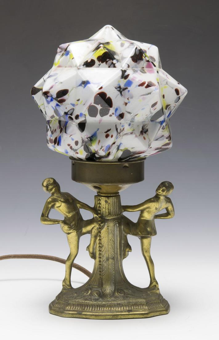 Art Deco Spelter Table Lamp with Czech Shade: Gold finish base with two dancers surmounted by an multicolor starburst shade that is marked 'Czechoslovakia'. Dimensions are: 13 1/8" tall, 6" wide. All measurements are approximate. Condition: Some 