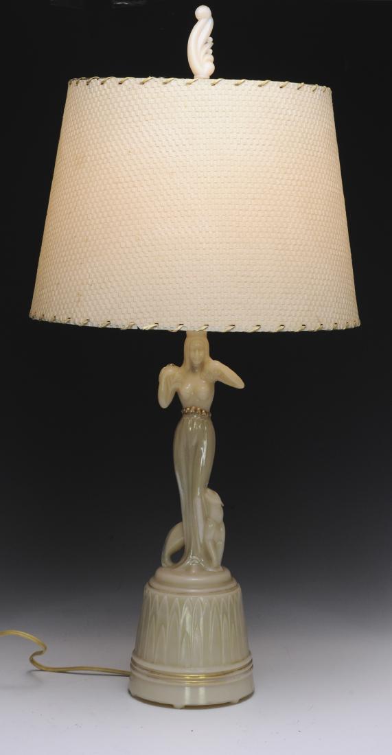 Aladdin Figural Glass Lamp, Woman with Panther: A rare Art Deco Aladdin lamp with semi-nude woman and a panther. Made of "Alacite" glass. Finial is also original Aladdin "Alacite" glass. Dimensions are: 25 5/8" tall, 5 1/2" dia. All measurements ar