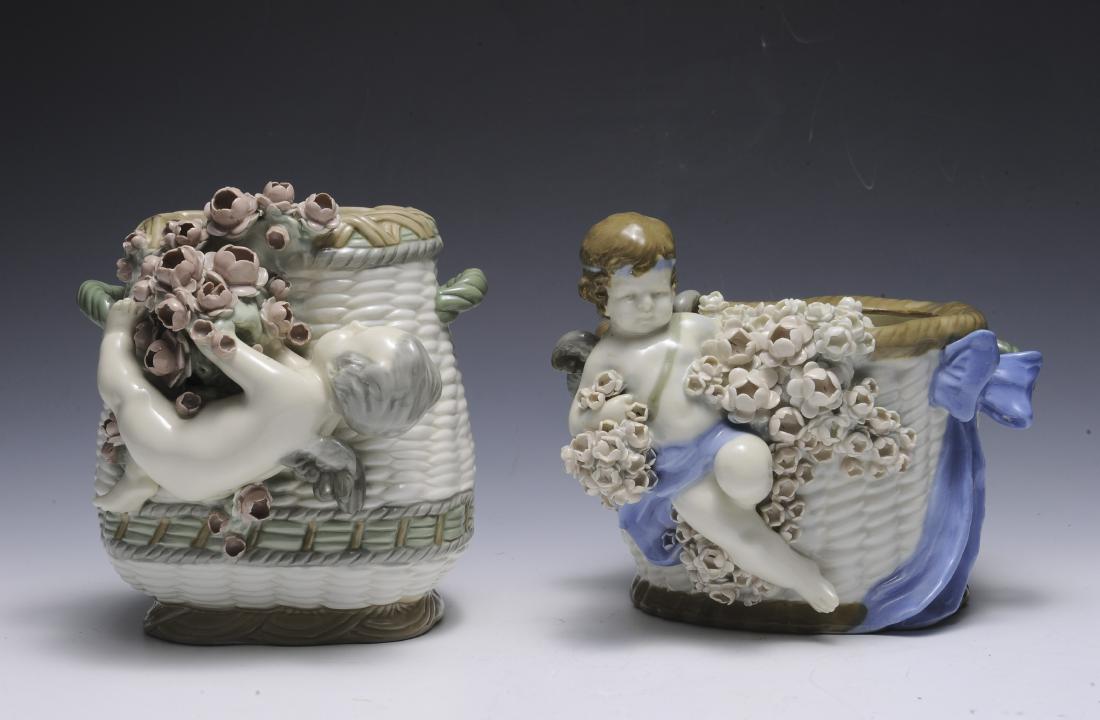 Two Amphora Baskets with Cherubs: Both with impressed marks and Amphora stamps. Dimensions are: largest 8" tall. All measurements are approximate. Condition: No noted damage. Excellent. Provenance: The lifetime collection of Linda Rac