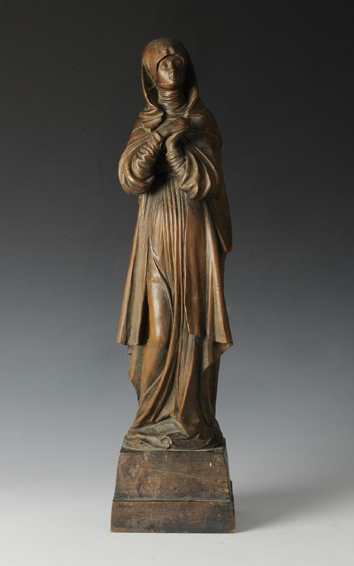 Signed Carved Wood Nun Circa 1900: Signed F. Schild on front, possibly German or Austrian. Dimensions are: Largest - 17 3/4" tall. All measurements are approximate. Condition: Crack to wrist of right hand with a piece missing from back