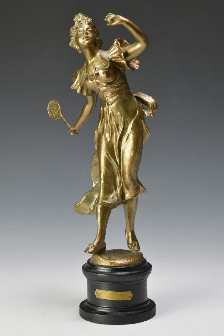 "Well Caught" Spelter Figure of a Tennis Player: Unsigned spelter figure of an Edwardian Female tennis player on wood plinth. Brass title plaque "Well Caught". Dimensions are: 15 1/4" tall, 9" wide. All measurements are approximate. Condition: Small