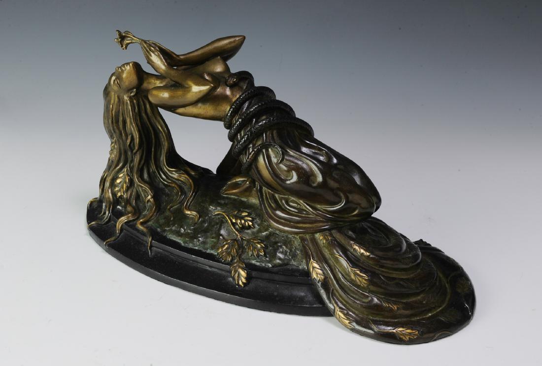 Erte Bronze "Perfume" 192/300: Patinated bronze reclining nude woman holding flowers. A stylized JM hallmark on the base followed by "Fine Art Acquisitions" with the Copyright 1984. Dimensions are: 14" long, 5 1/2" wide, 7" tall. A