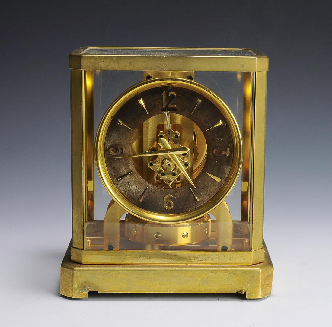 Jaeger Le Coultre Atmos Clock: Serial number 42367. Movement is complete with no visible damage. Dimensions are: 9 1/4" tall, 8 1/4" wide, 6 3/8" deep. All measurements are approximate. Condition: Some discoloration to case and dis
