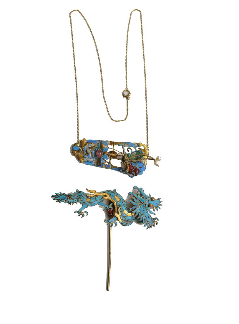 2 Chinese Kingfisher Feather Hair Pins, 19th Century: A set of two Chinese kingfisher feather and gilt hair pins, both dating from the 19th century. One is in the shape of a dragon, the other is a plaque with a bat, butterfly, and Buddhist swastika. Dime