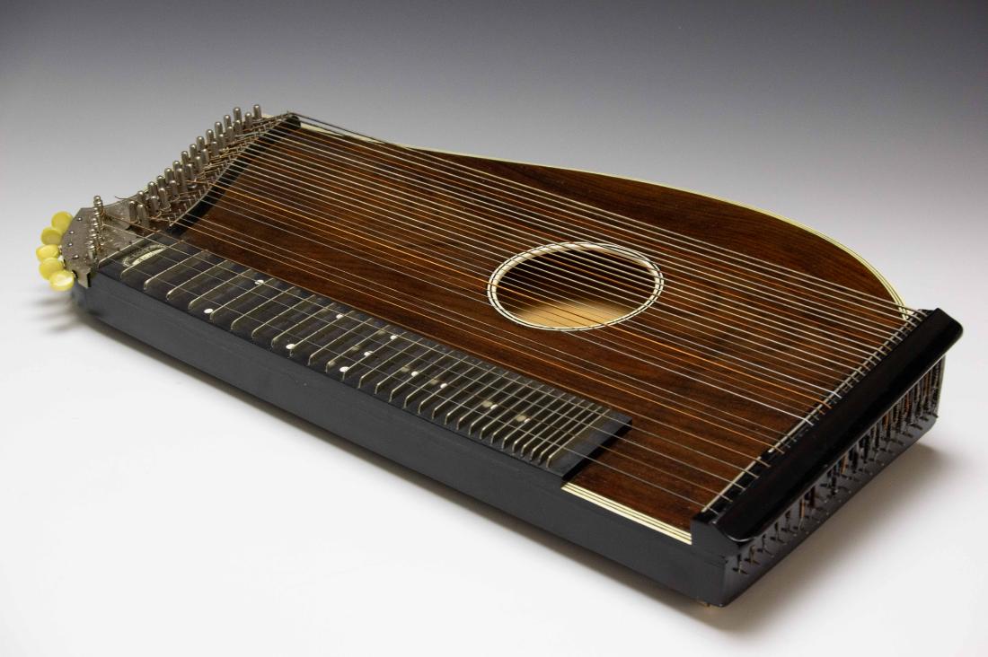 Concert Zither Edelton in Hard Case: Concert Zither Edelton in Hard Case: Comes in case by Ideal. Dimensions are: 23" long x 12 1/4" wide. All measurements are approximate.