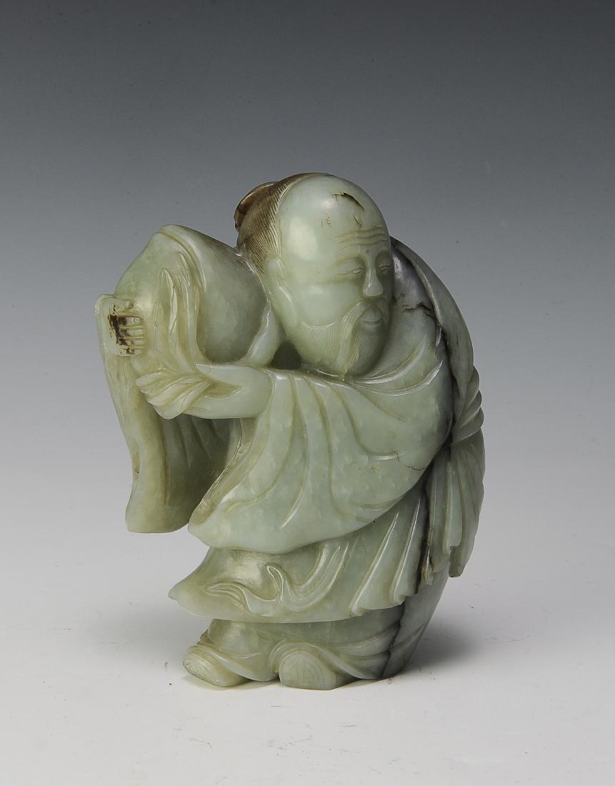 Chinese Jade Carving of Shou, Ming Dynasty: A Chinese jade carving of Shou holding a peach and dating from the Ming dynasty, Dimensions are: 5 3/4 inches tall X 4 1/4 inches wide. All measurements are approximate. Condition: It is in good condi