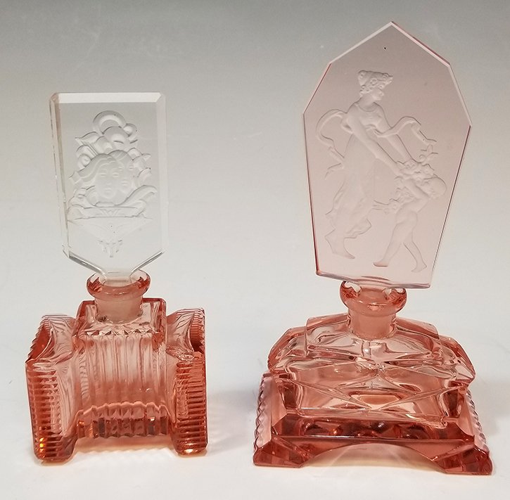 (2) Pink Czech Glass Perfumes Intaglio Stopper: Pink Czech Glass Perfume Bottle intaglio stopper depicting Cupid and a standing woman, retains wand. Architectural bottle marked 'Made in Czechoslovakia' with intaglio stopper depicting a kneeling wom