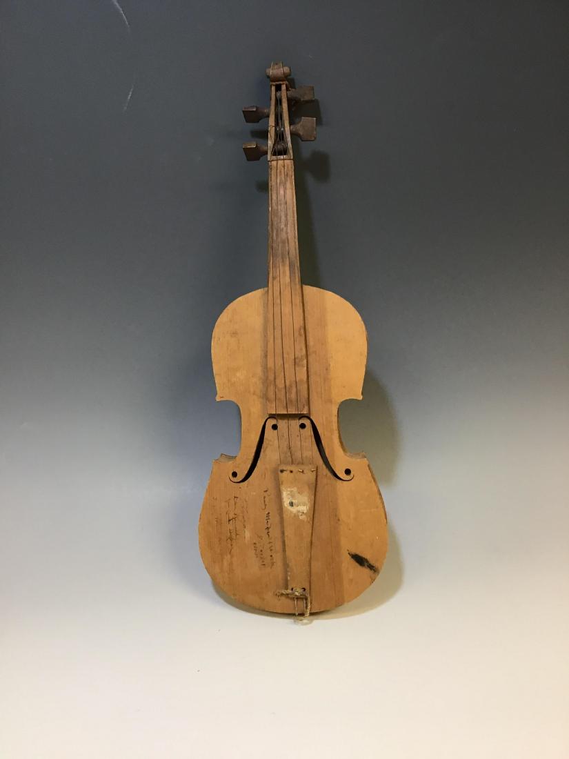 Folk Art Wood Violin / Fiddle Circa 1930s: Folk Art Wood Violin / Fiddle Circa 1930s: American, circa 1903s, Constructed of bent and carved wood with metal strings attached to the tail piece and tuning pegs with carved 'F' holes. Several signa