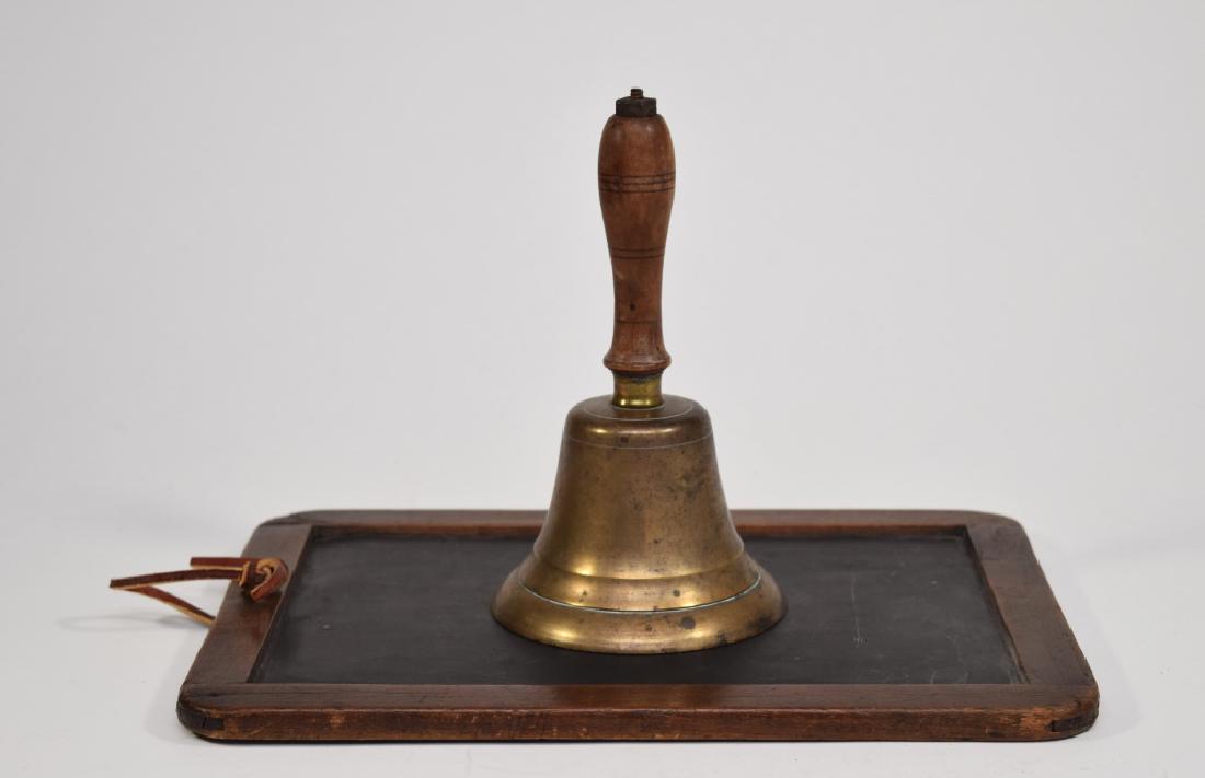Antique Chalkboard and School Bell: 19th Century slate with chamfered edges. Comes with a period handheld brass school bell. Dimensions are: Slate - 10 5/8" X 7 3/4". All measurements are approximate. Condition: No noted damage.