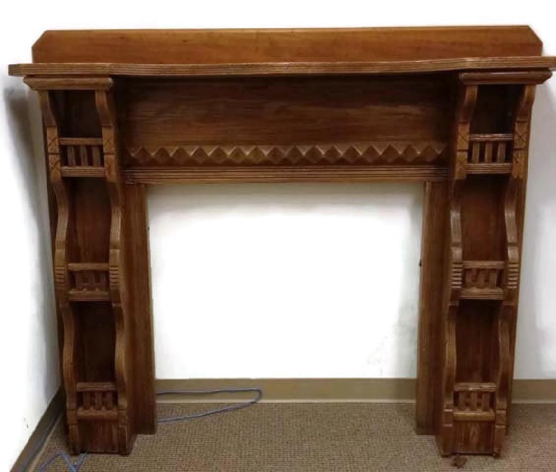 Wood Fireplace Mantle: Wood Fireplace Mantle. Dimensions are: 53 1/2" tall, 62 3/8" wide, 10 3/4" deep. All measurements are approximate. Condition: Scattered chipping and scuffs.