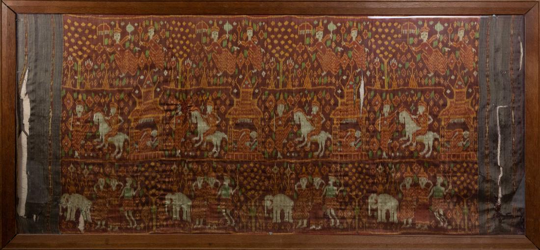 Framed Red Ground Cambodian Pidan Tapestry: A framed Cambodian woven wall hanging on red ground depicting scenes of human figures. Dimensions are: the frame measures 35 inches tall X 74 1/2 inches wide. All measurements are approximate. Conditi