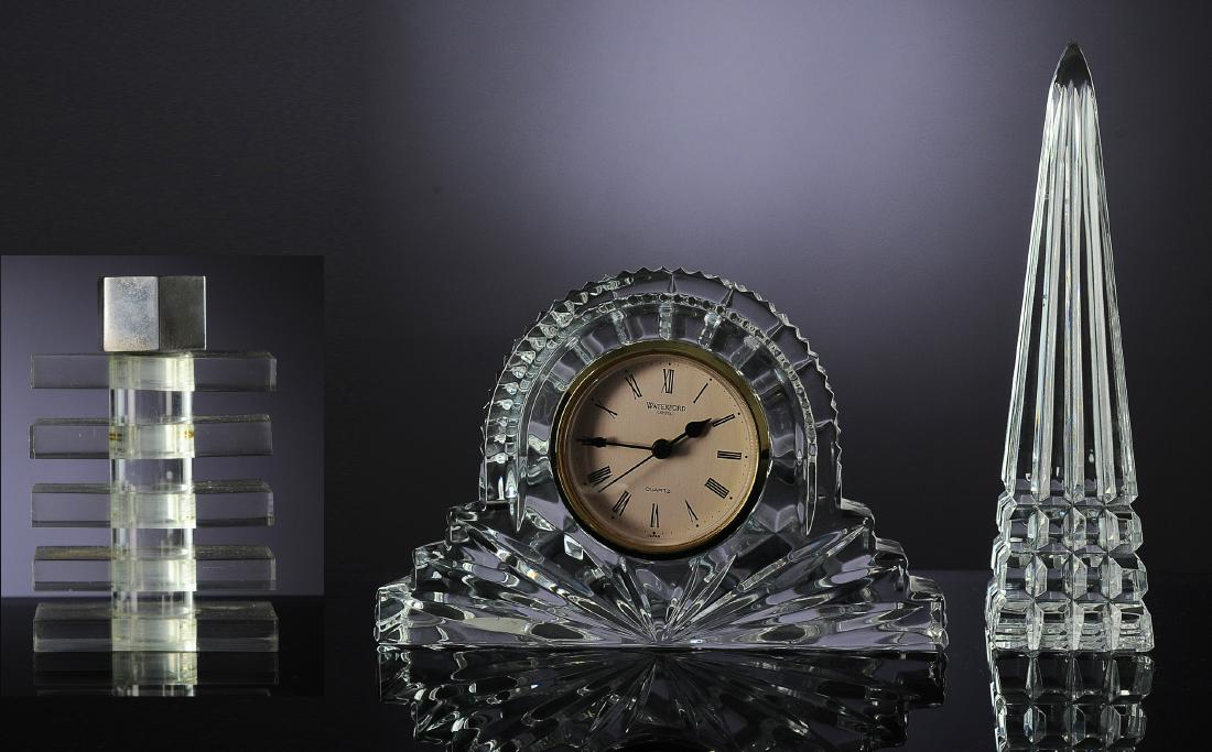 (3) Waterford Crystal Clock and Obelisk & Perfume: Two signed pieces of Waterford crystal. One is a desk clock and the other is an obelisk. Dimensions are: clock 7 1/8" wide, 1 7/8" deep, 4 5/8" tall. A mid-century modern perfume bottle made of Lucite