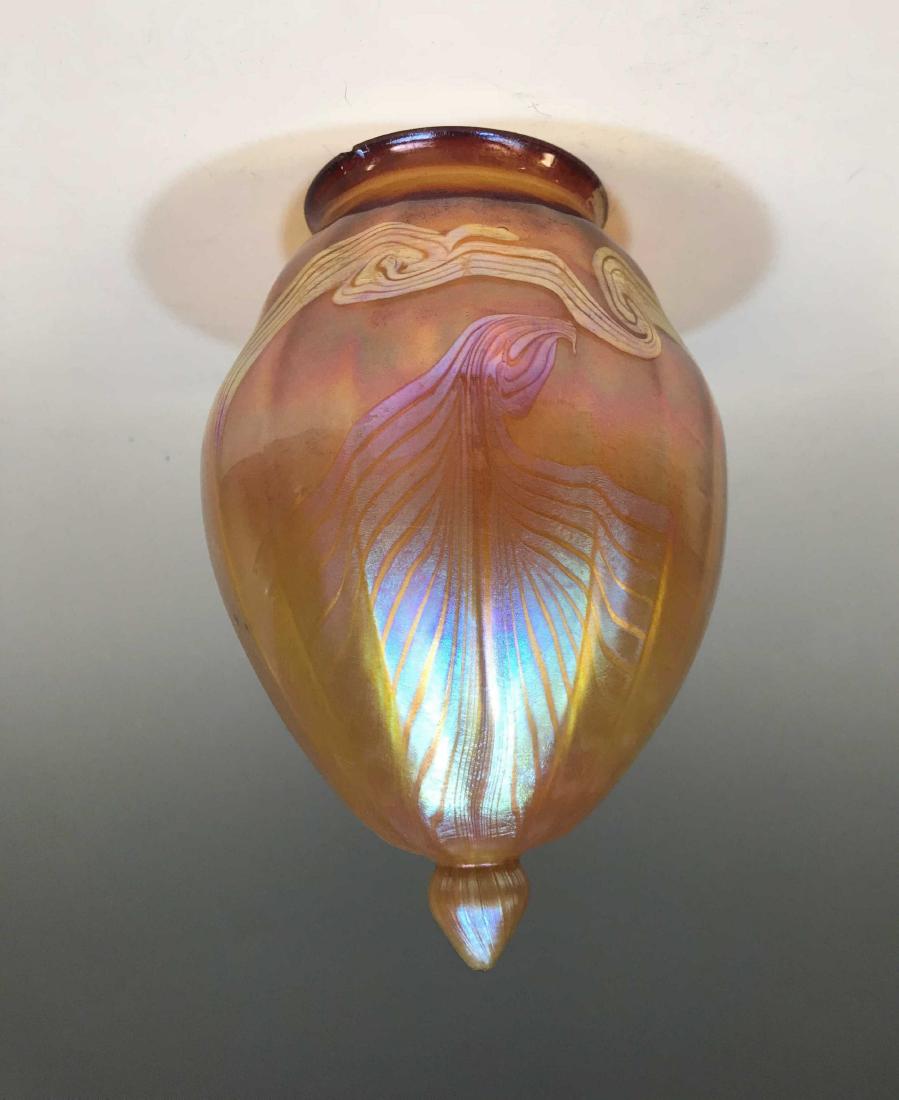 Favrile Art Glass Pendant Shade Iridescent Orange: Favrile Art Glass Shade: American, ribbed sides and pendant drop with pulled feather glass decoration, etched, 'L.C.Tiffany Favrille' but not authenticated as such, Dimensions are: 7 1/2" high X 5.09"