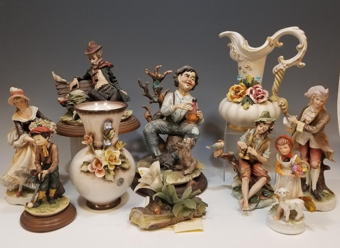 (10) Capodimonte & other Porcelain Figures: Capodimonte ewer & vase, Capodimonte flower, Capodimonte figures: Tramp on a bench, boy with horn, girl with lamb and Man with wine Jug. Lot also includes two Lefton China figures and an Italian made