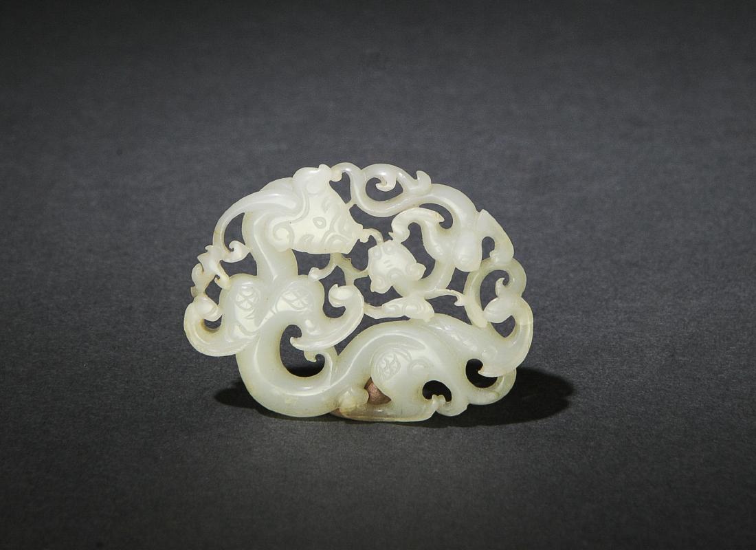 Chinese White Jade Plaque w/ Chilong, 17th Century: A Chinese white jade pierced plaque carved with a pair of chilong and dating from the 17th century. Dimensions are: 1 1/2 inches tall X 2 1/8 inches wide. All measurements are approximate. Condition: 
