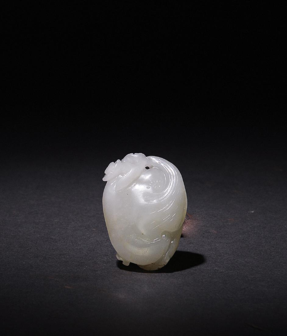 Chinese White Jade Lotus & Lingzhi Toggle,18-19 C.: A Chinese white jade carving of lotus flowers and lingzhi dating from the 18th to the 19th centuries. Dimensions are: 1 1/2 inches tall X 1 inches wide. All measurements are approximate. Condition: It