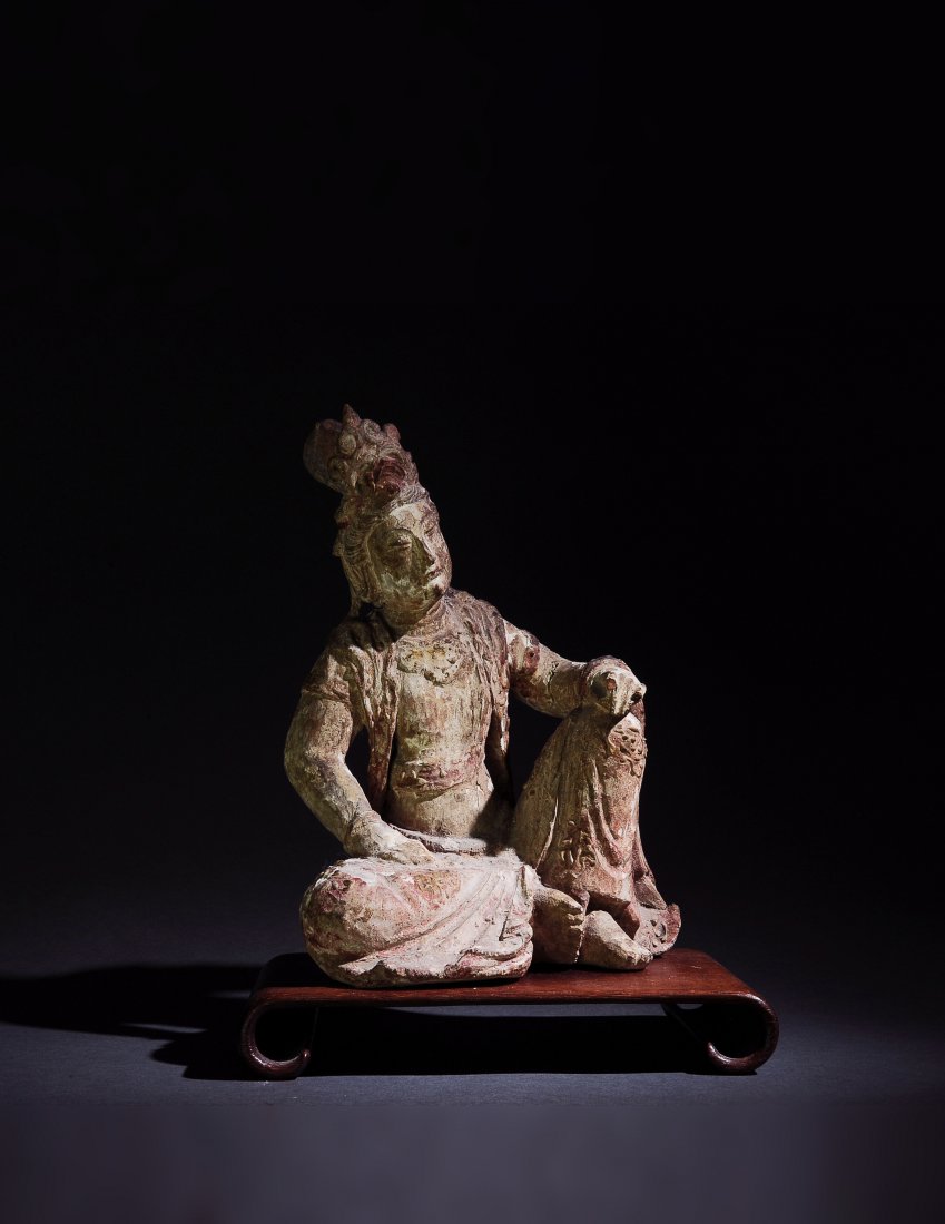 Chinese Wood Guanyin, Ming Dynasty or Earlier: A Chinese wooden statuette of a seated Guanyin dating from the Ming dynasty or possibly even earlier. Dimensions are: 11 1/2 inches tall X 9 inches wide. All measurements are approximate. Condition: T