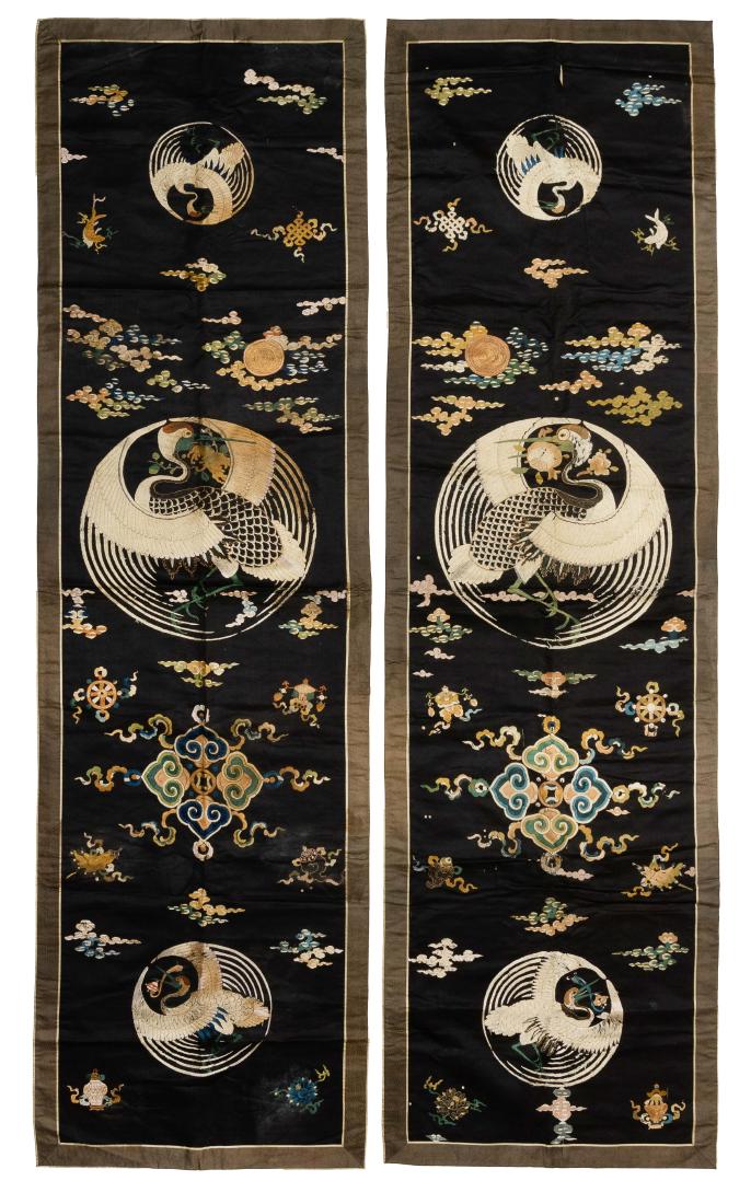 Pair of Chinese Silk Panels w/ Cranes, 18th C.: A pair of Chinese silk panels embroidered with 3 crane medallions and the 8 Buddhist Emblems and dating from the 18th century. Each is mounted on a silk backing. Dimensions are: 77 3/4 inches tall X 2