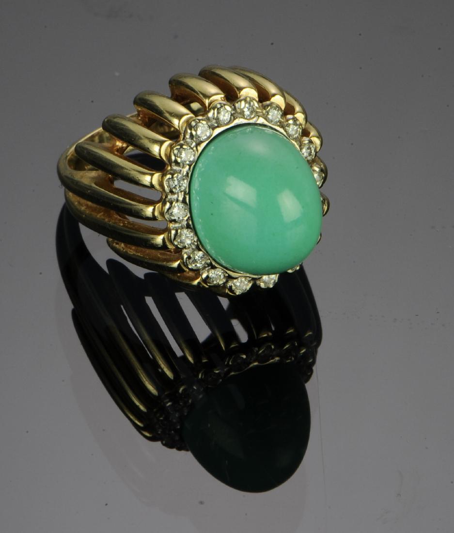 14K Gold, Diamond & Persian Turquoise Ring: 14K gold marked and tested ring with Persian turquoise center surrounded by 18 diamonds totaling approximately .36 ctw. Dimensions are: 1 3/8" tall, 13/16" long. Ring size 6. Total weight: 12.2 g (0.3