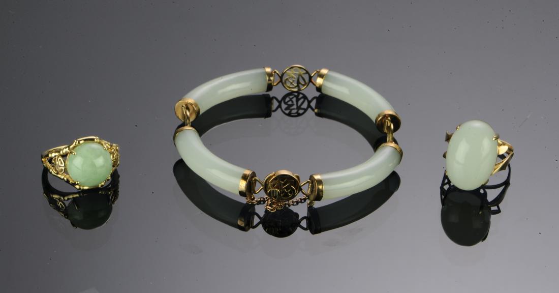 (3) Jade 14K Gold Rings & 10K Gold Bracelet: (3) Jade Jewelry Pieces, two 14K Gold Rings and a 10K Bracelet: circa 1960s: a) 14K yellow gold ring prong set with a jade cabochon (19 x 13.4 mm), impressed 14K, size 6, weight: 6.74 g, .21 ozt. b) 1