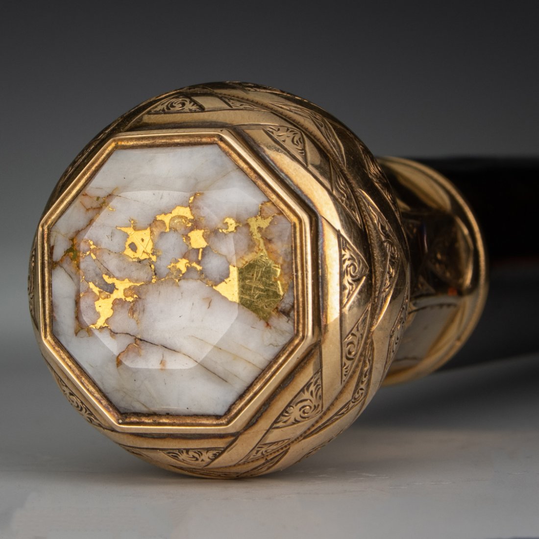 Presentation Cane with 14k Gold and Gold in Quartz: Presentation Walking Cane with 14k Gold and Gold in Quartz: circa 1860s, Ebony shaft supporting a tested 14k yellow gold handle engraved with strap-work and geometric designs, engraved 'Fred Quint' on