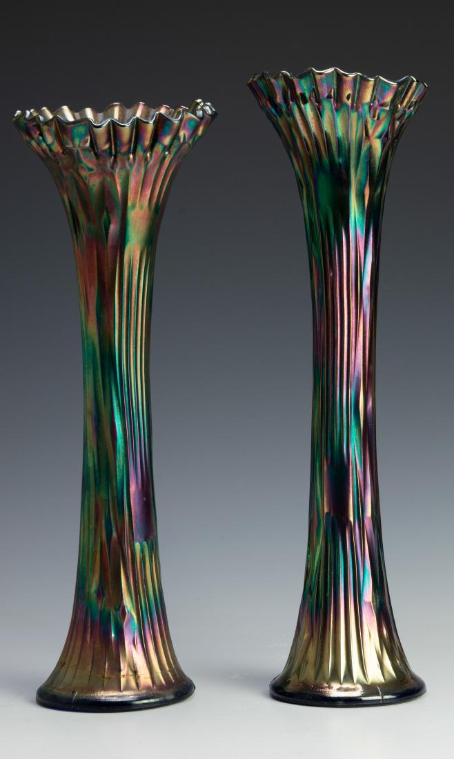 Pair Fenton Glass Iridescent Rib Swung Vases: Pair Fenton Glass Iridescent Rib Swung Vases #916: each in an iridescent on a blue ground, with wasted bodies and crimped lip. Dimensions are: base: 3 3/4" base X 14 1/2" tall. All measurements are ap
