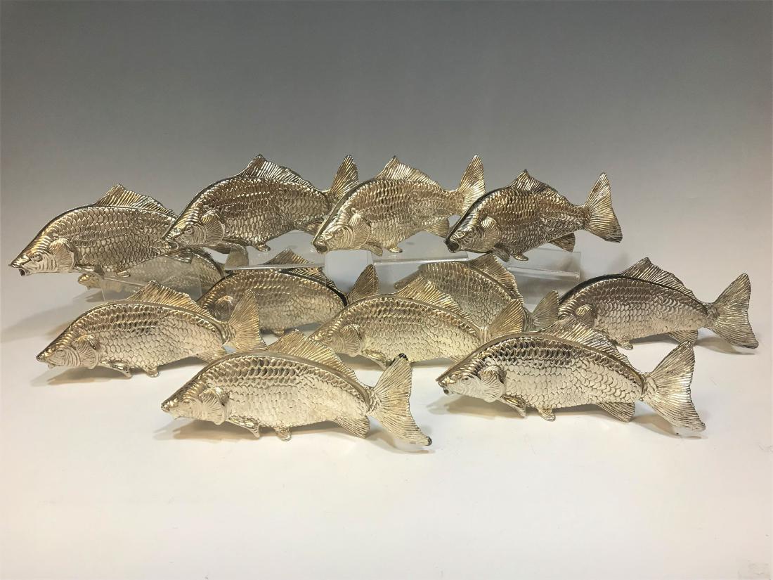 (12) Italian Modello Desposito Silver Fish: (12) Italian Modello Desposito Silver Fish napkin rings: mid 20th century, Italy, twelve silver plated swimming carp originally designed as napkin holders. Maker's mark cast into the body. Dimensions