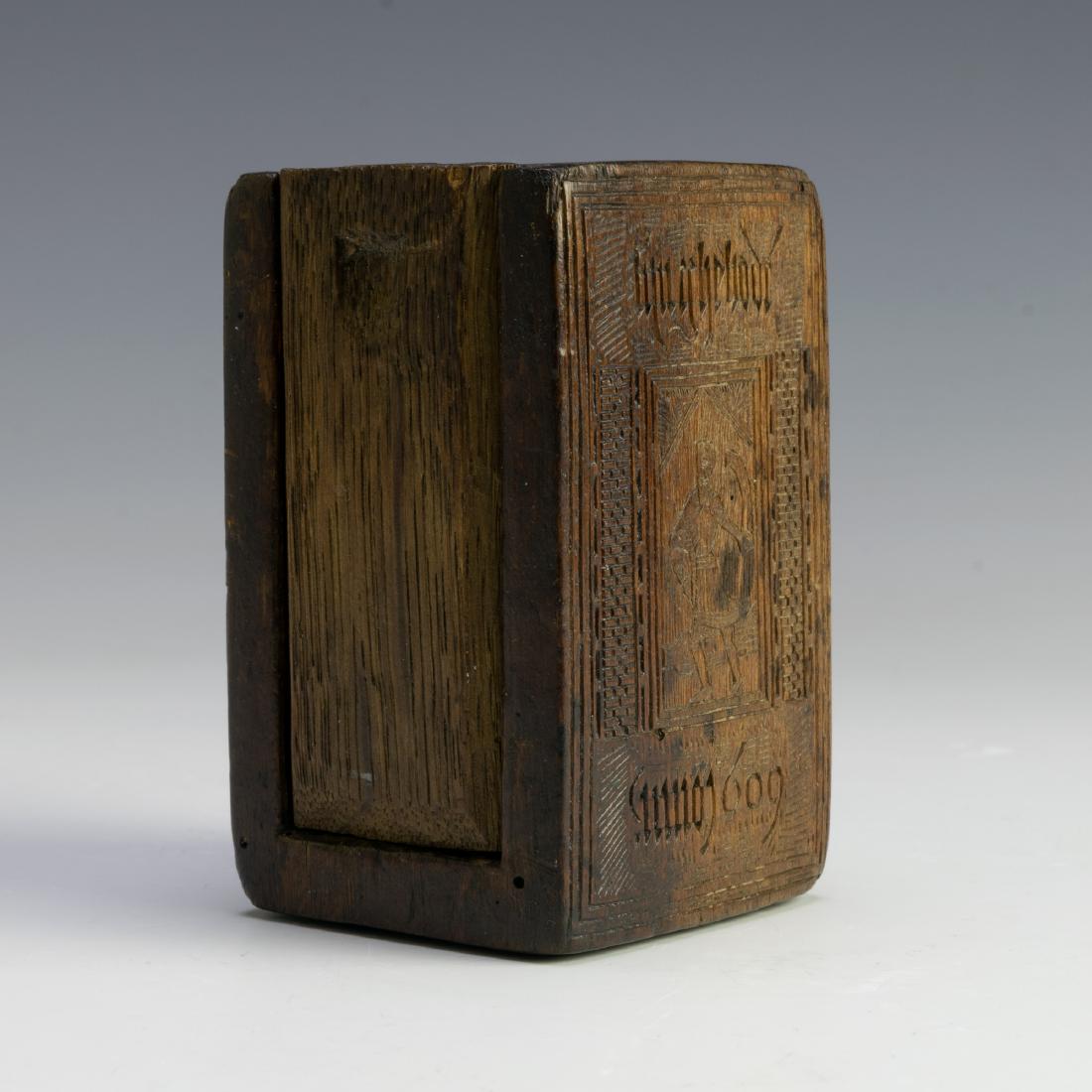 17th-18th c. Welsh Chip Carved Treenware Wood Box: 17th - 18th c. Welsh Chip Carved Treenware Wood Box: Carved from a single block of wood with a slide top and four sides depicting figurative scenes including a figure playing a Welsh harp (telyn deire