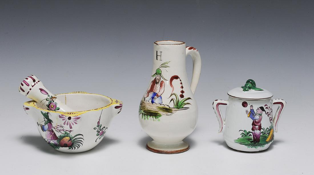 (3) Luneville Chinoiserie Mortar Pestle Cruet Jar: Three pieces of French faience chinoiserie including a mortar and pestle, an oil cruet, and a lidded jar with two handles. All are decorated with stylized Chinese figures. Includes: a) matching mortar